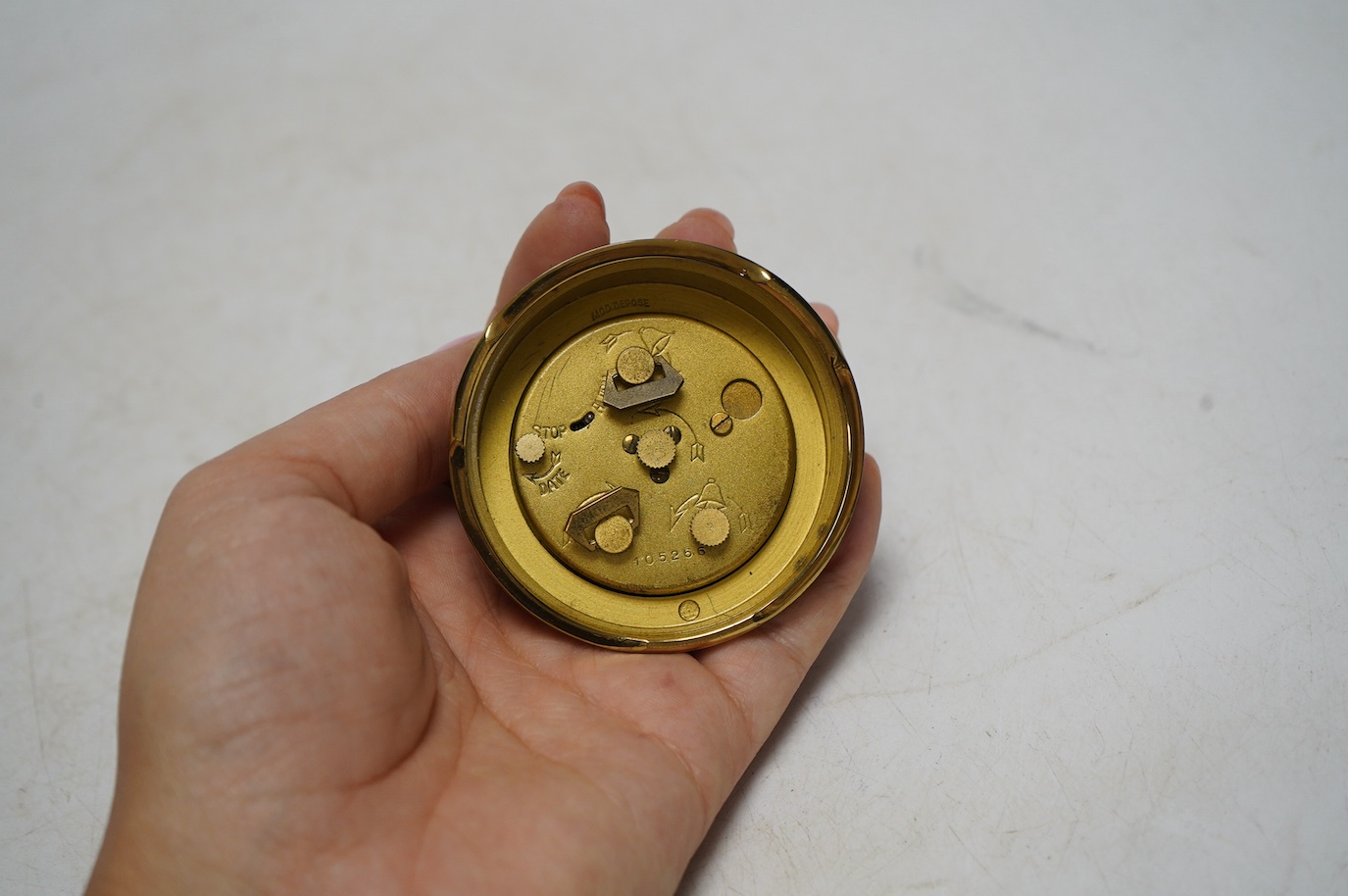 A Turler crocodile cased travelling alarm timepiece and another in green leather. Condition - green case a little scuffed, both wind and are currently ticking but not guaranteed